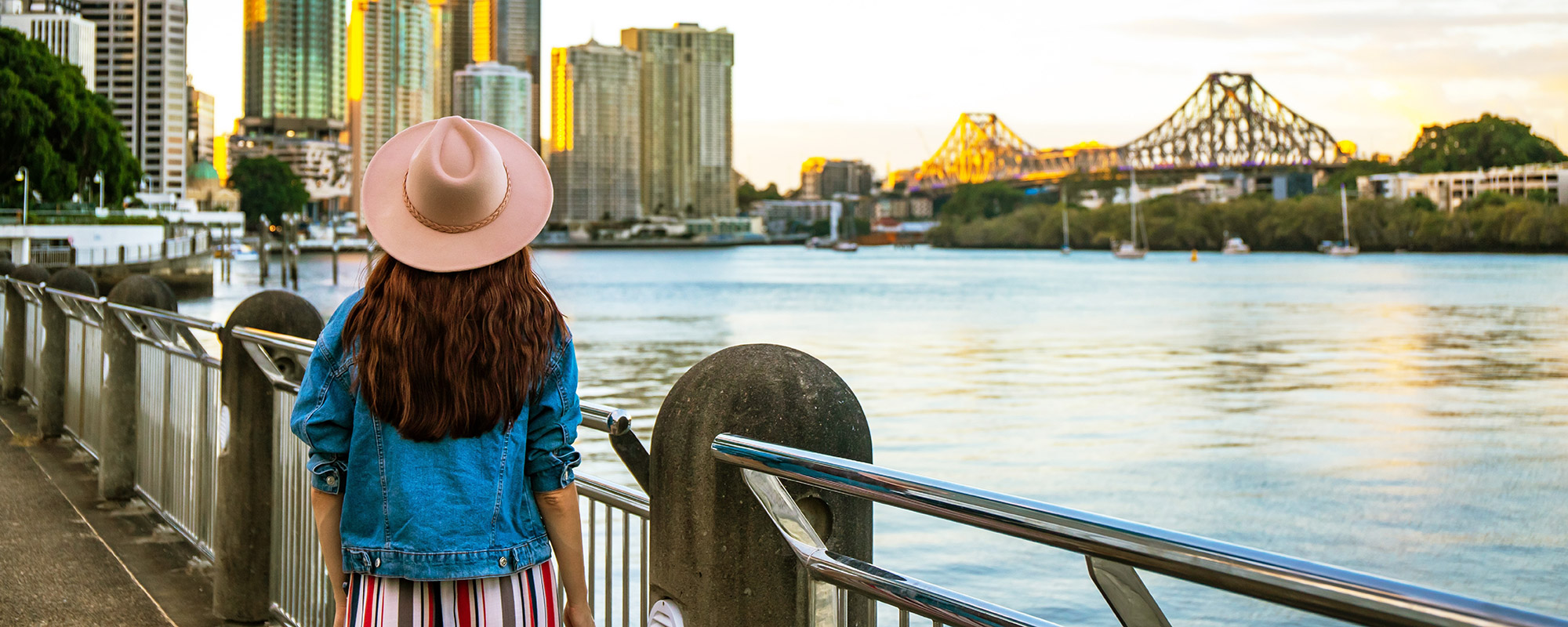 Female looking over the Brisbane River. 