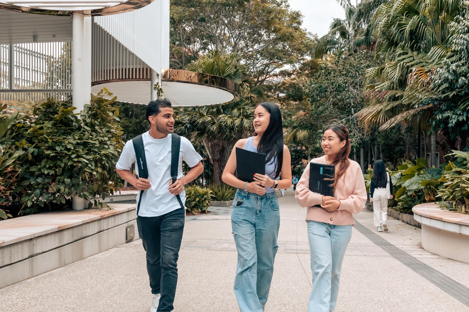 Three students walking together in Brisbane. 