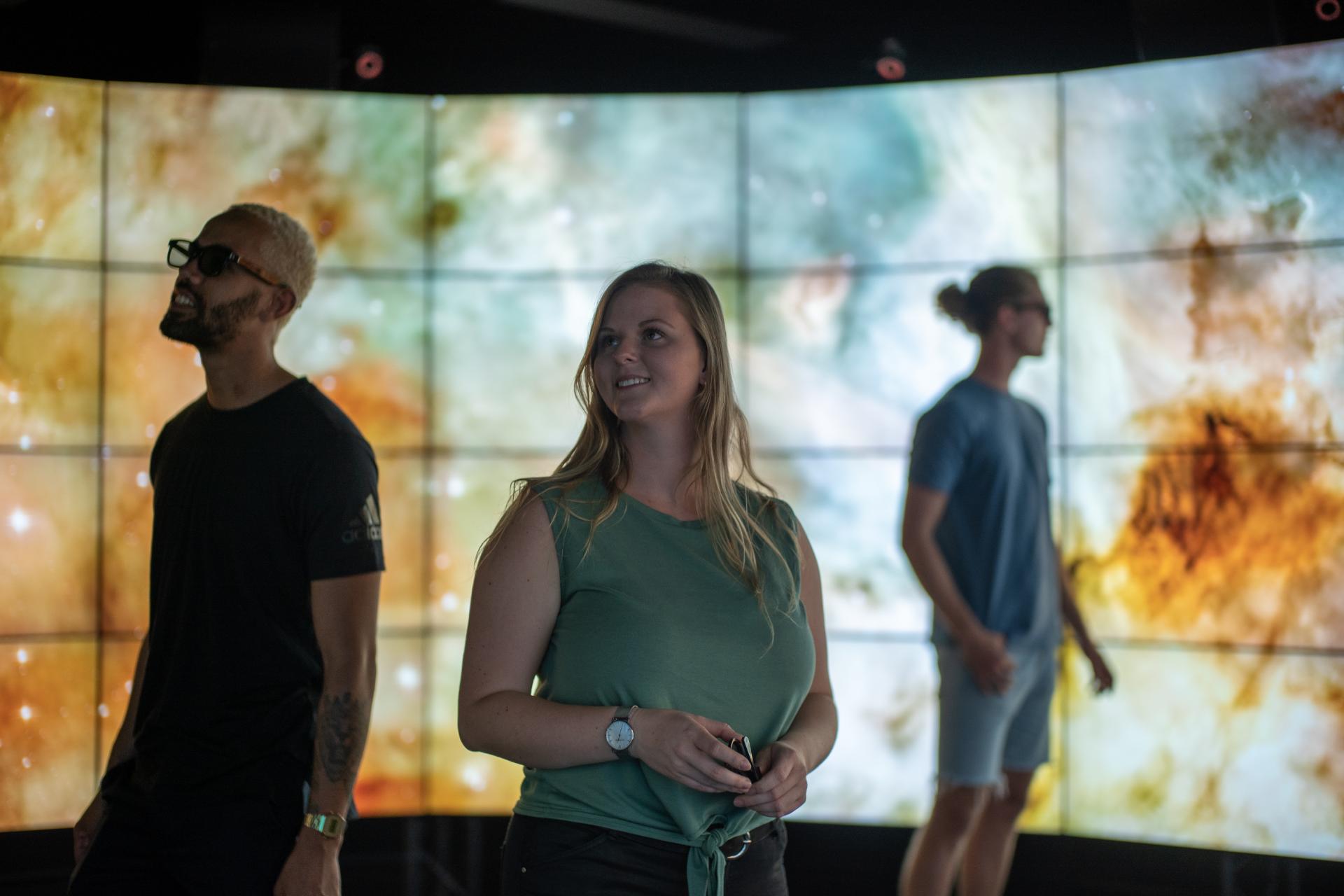 Three students in a virtual environment on the Sunshine Coast.